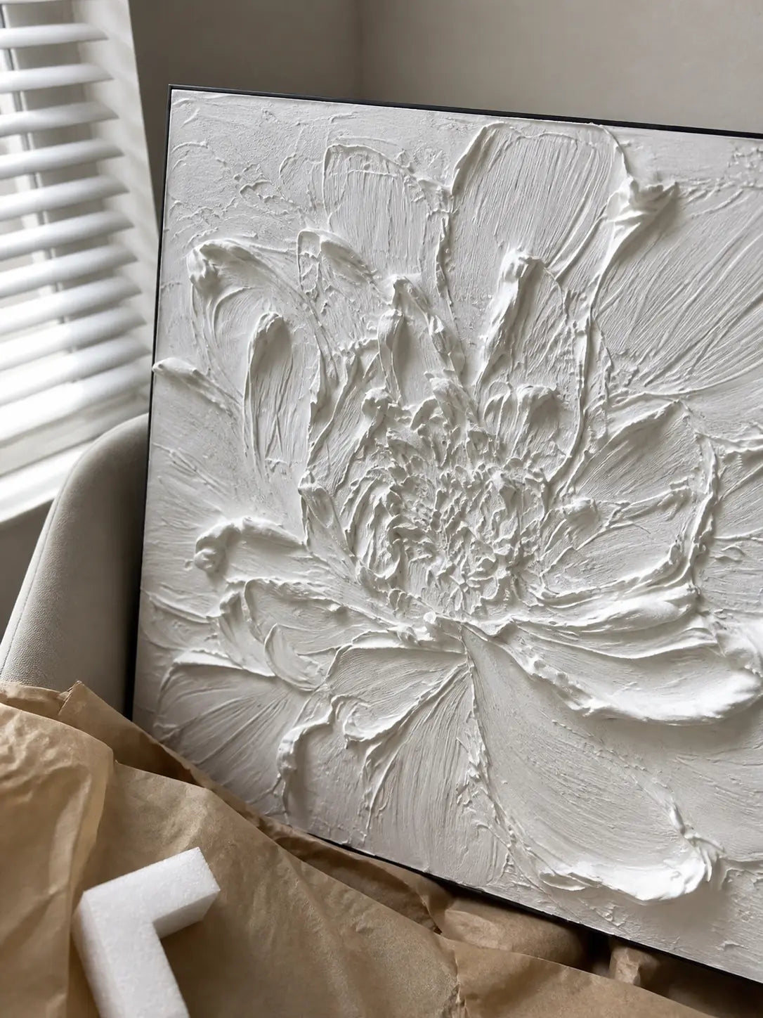 Side view of a canvas painting showing the stretcher depth and painted surface.